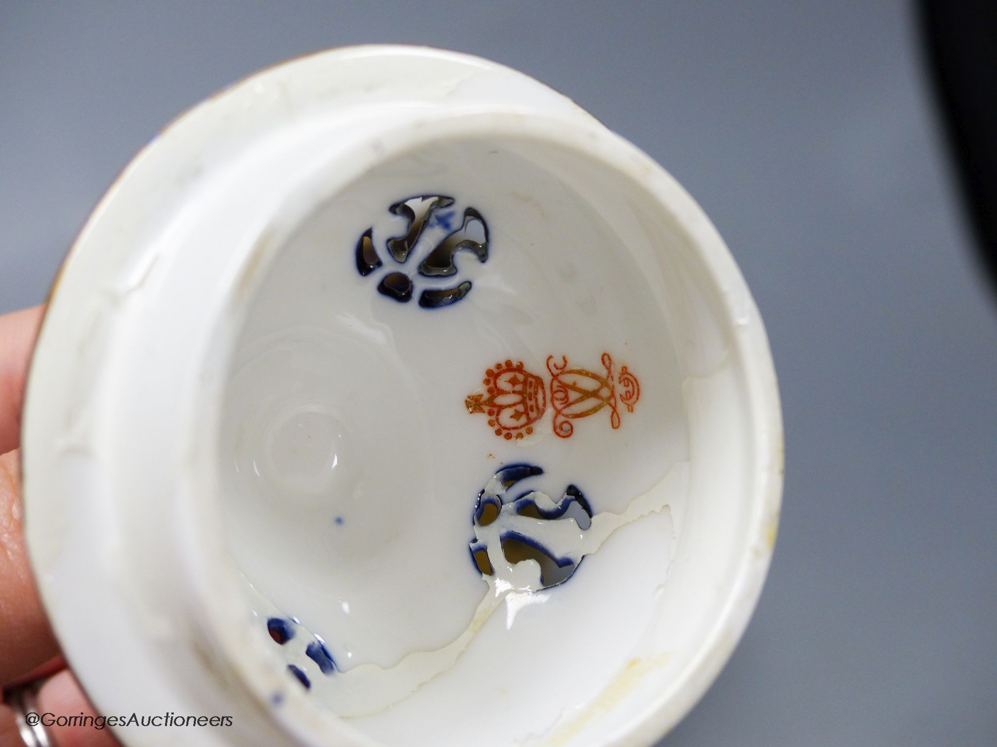A pair of Crown Derby blue and gilt vases, both with restored lids, height 21cm